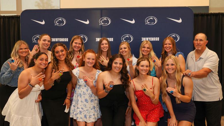 softball players holding up ring pops