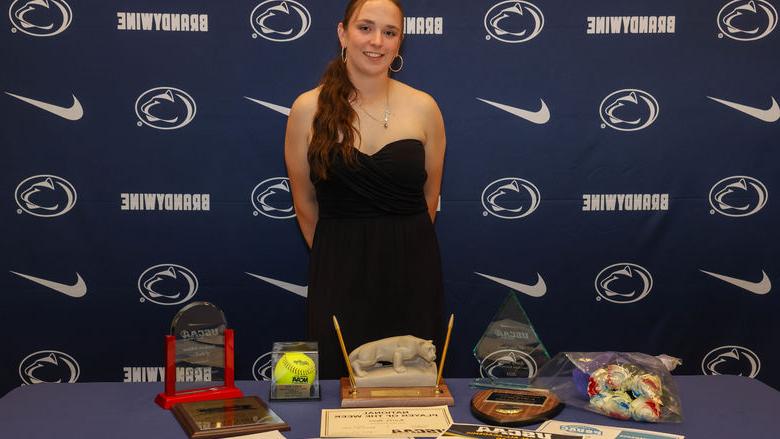 people with awards on a table